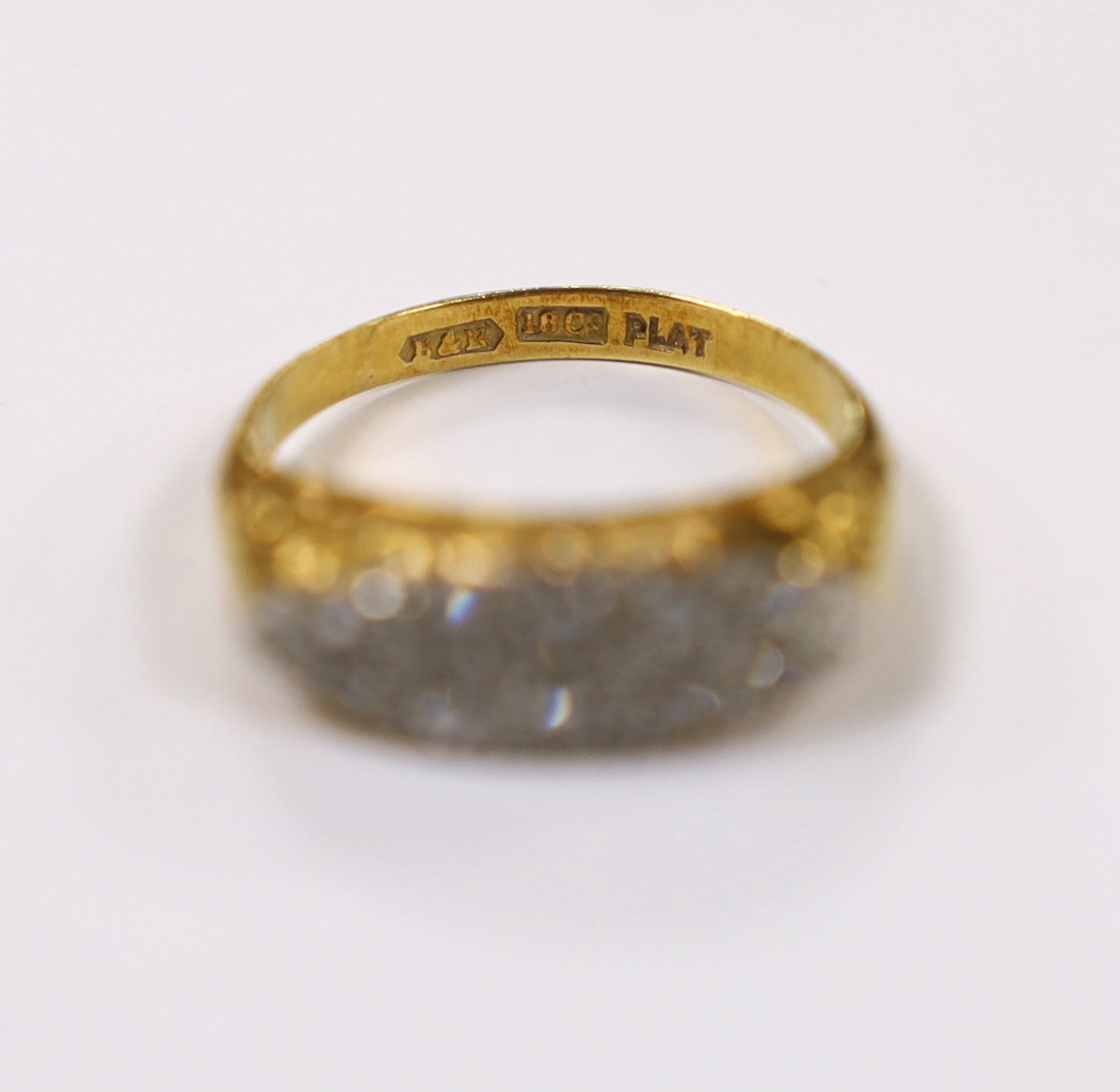 An 18ct, plat. and ten stone diamond set two row ring, size L, gross weight 4.9 grams.
